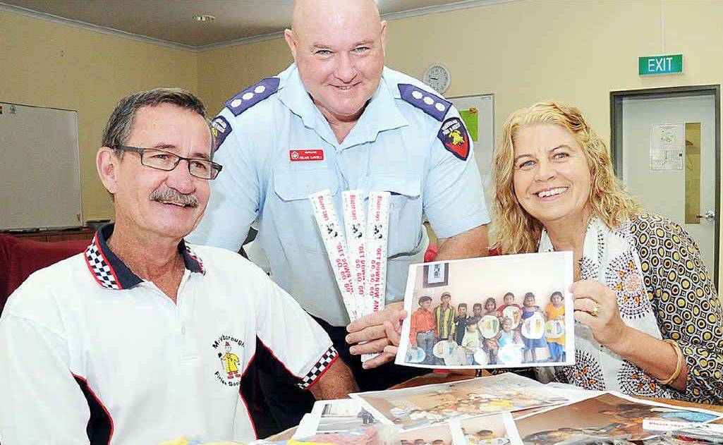 Firefighter Lionel Moores, Inspector Craig Lovell and Prue Brown, above, look over supplies for the CD21 school in India. Firefighter Lionel Moores, Inspector Craig Lovell and Prue Brown, above, look over supplies for the CD21 school in India.